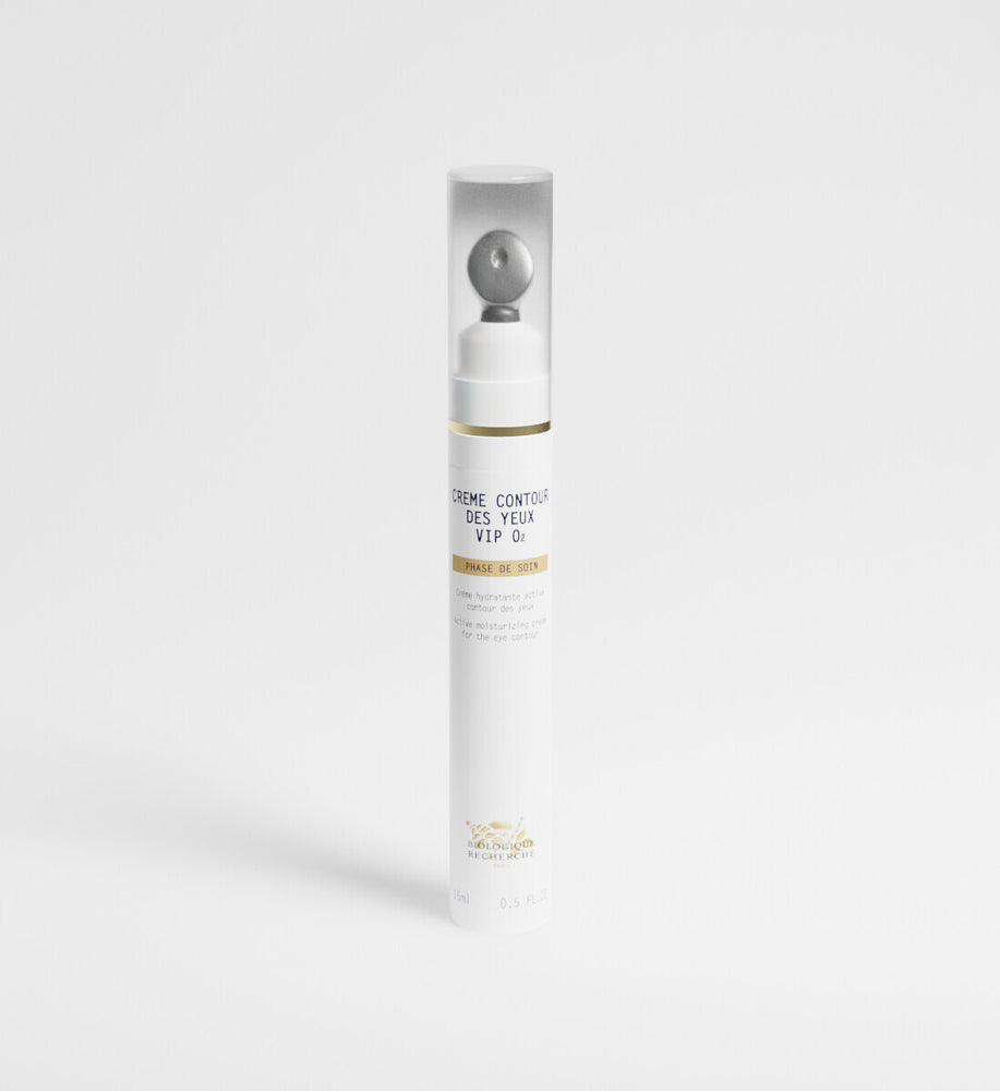 Skincare bottle with gold accents on a white background