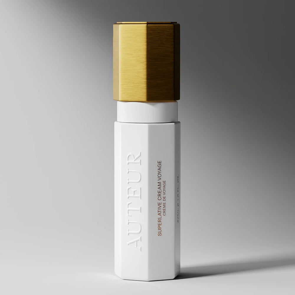 
                  
                    White skincare bottle with gold cap on a gray background
                  
                